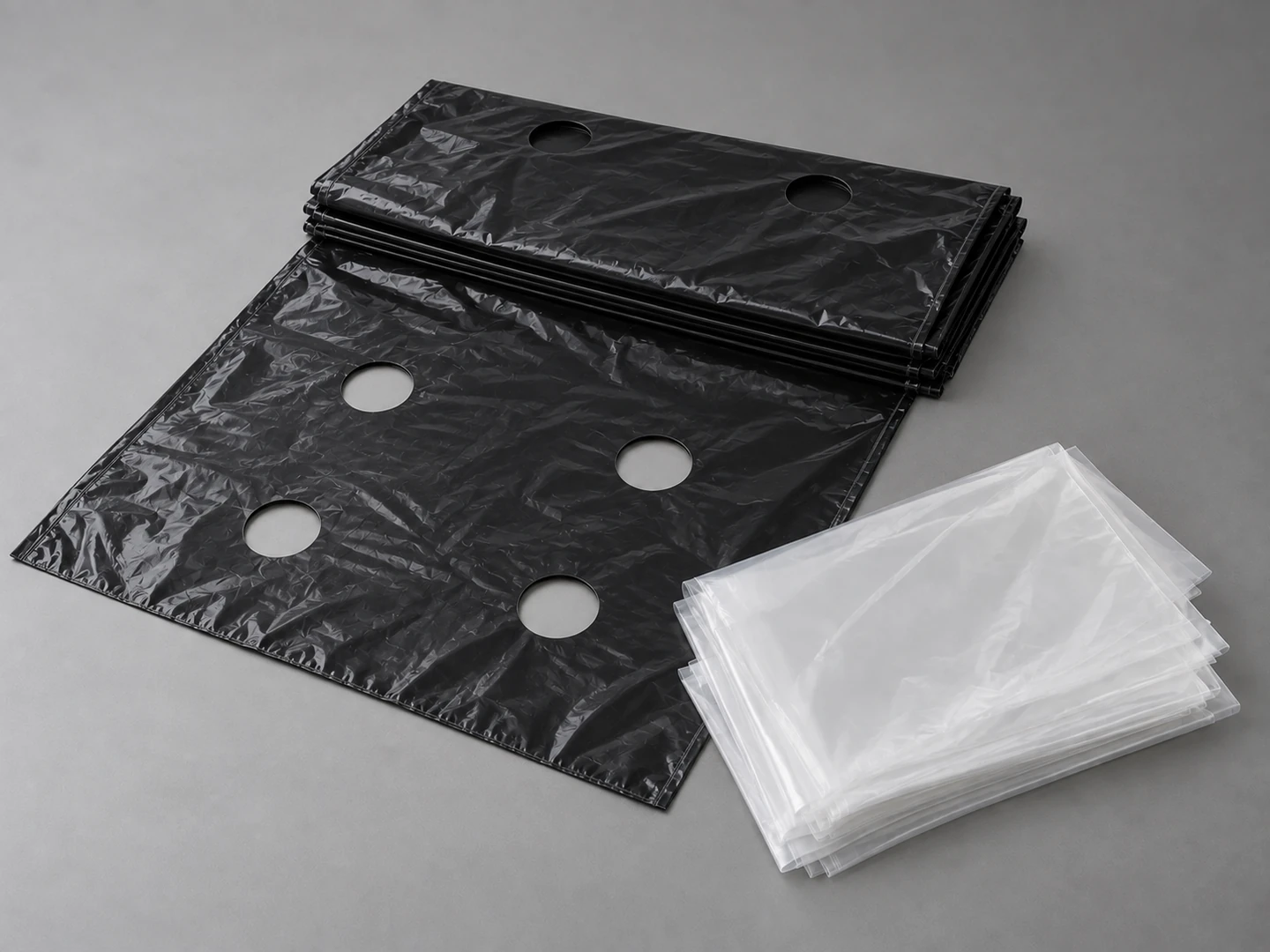 Illustrative folded agricultural film samples with planting apertures